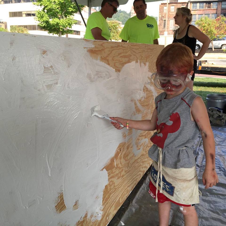 Bryson is hard at it painting his boat